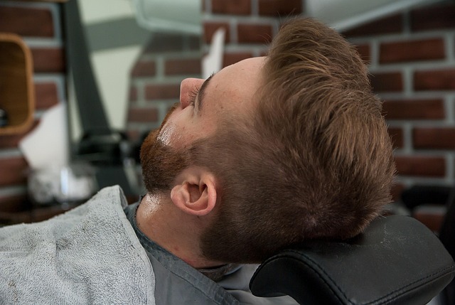 A close-up of a person's hair being styled in a salon, showcasing professional care.